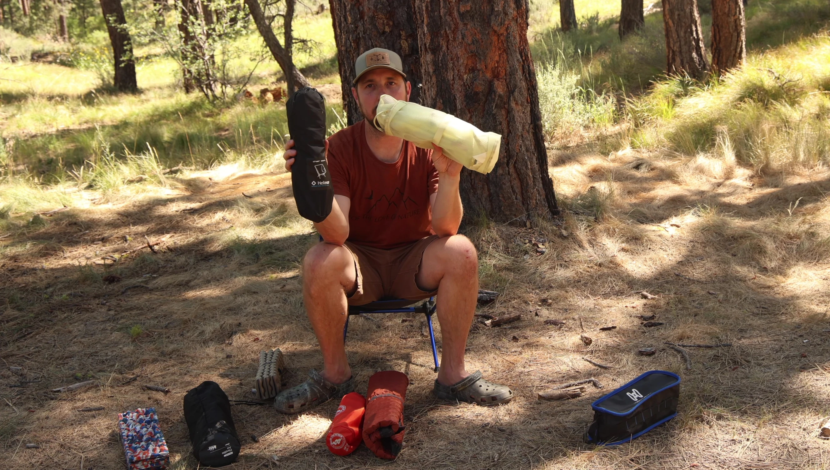 The reviewer comparing the Nemo Moonlight Elite and Helinox Chair Zero.