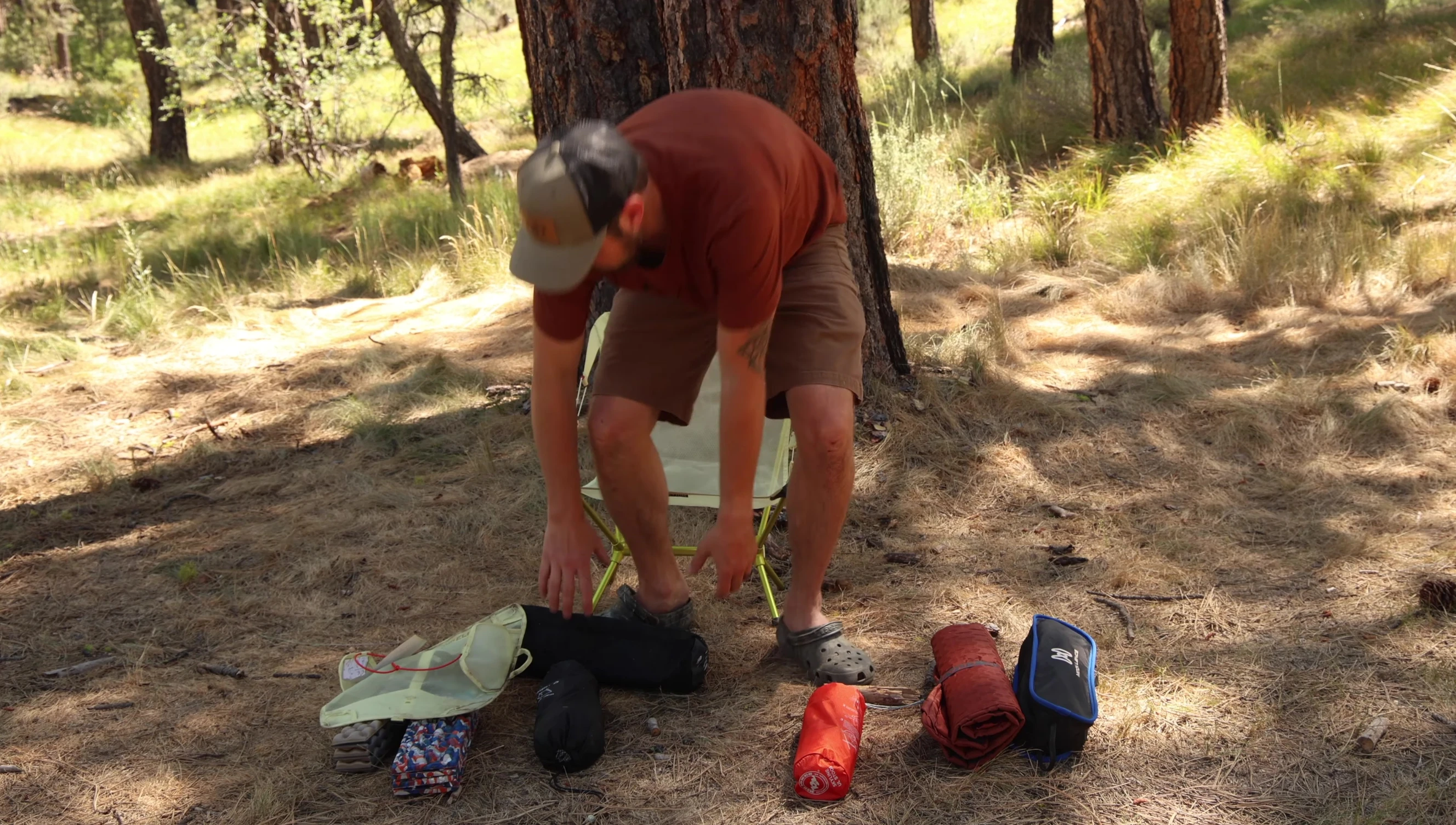 The reviewer demonstrating the comfortable reclining position of the Nemo Stargaze Lounge Chair.