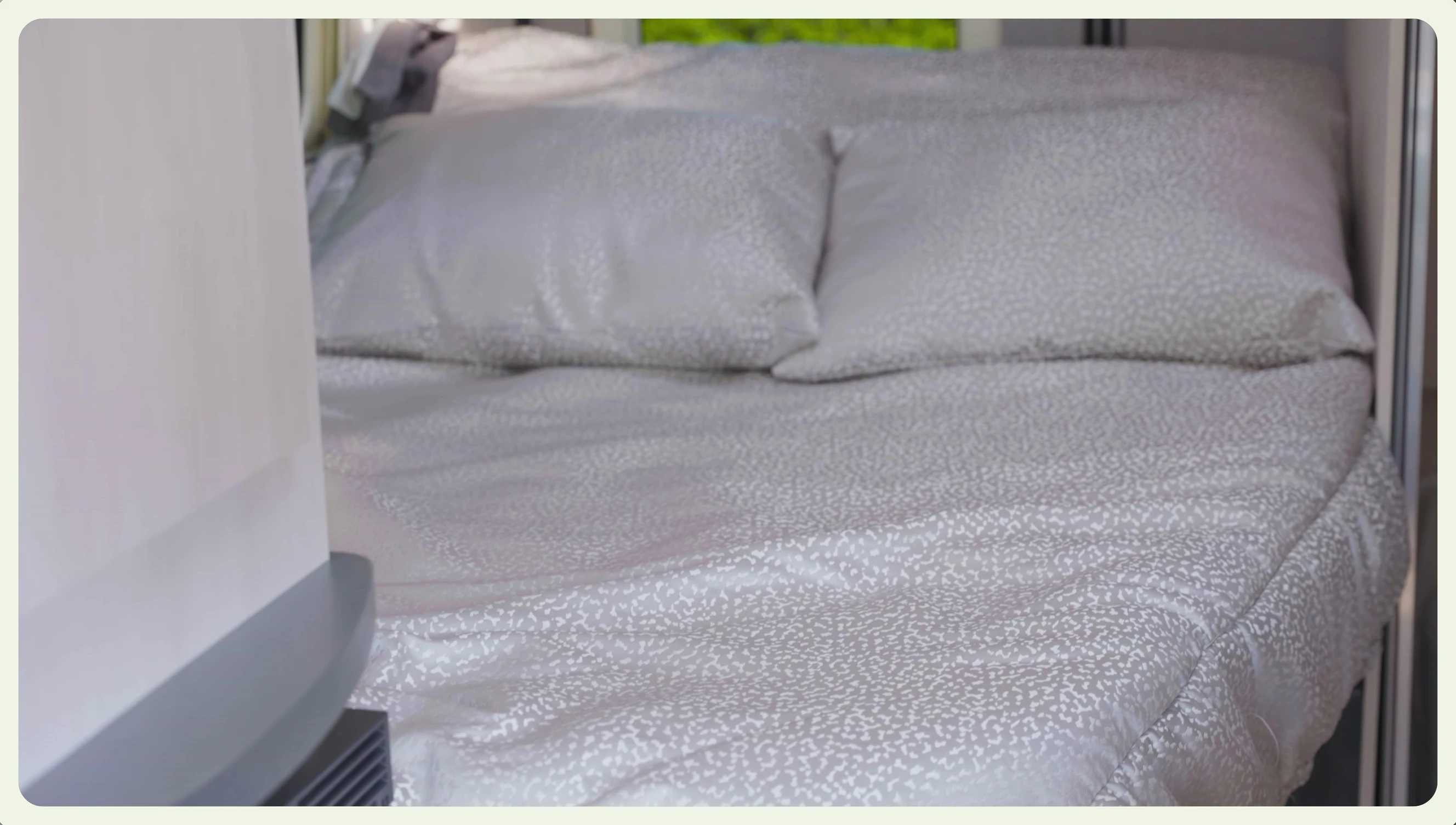 The fixed double bed with storage underneath.