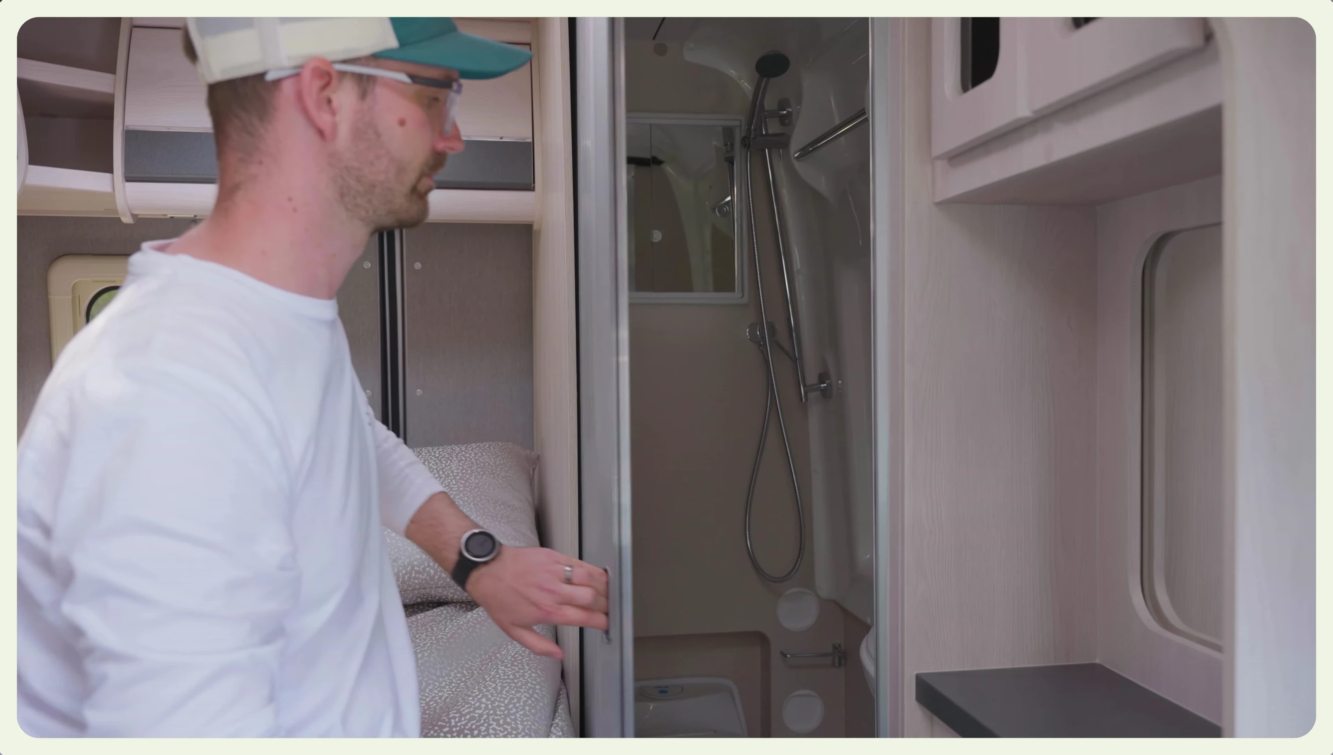 The washroom with shower, toilet, and sink.