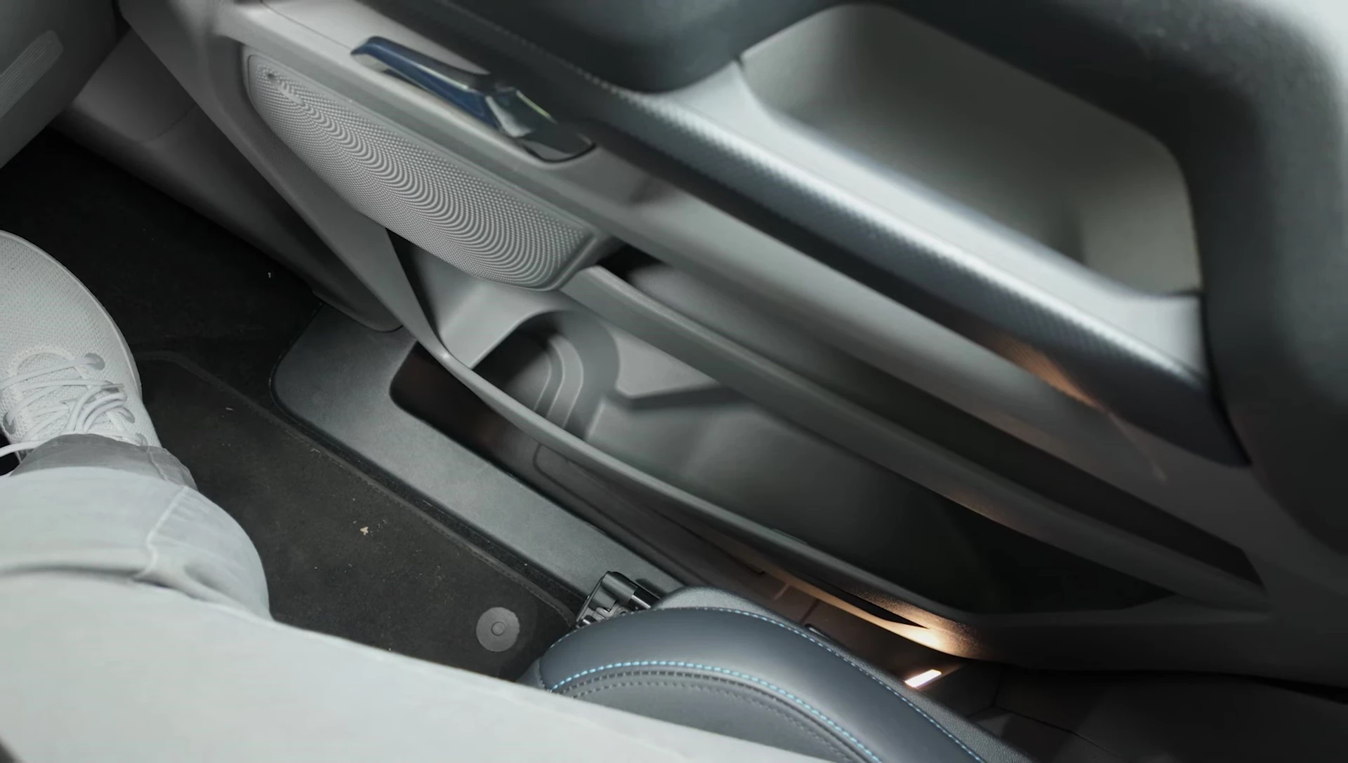Close-up of the storage compartments and cup holders.