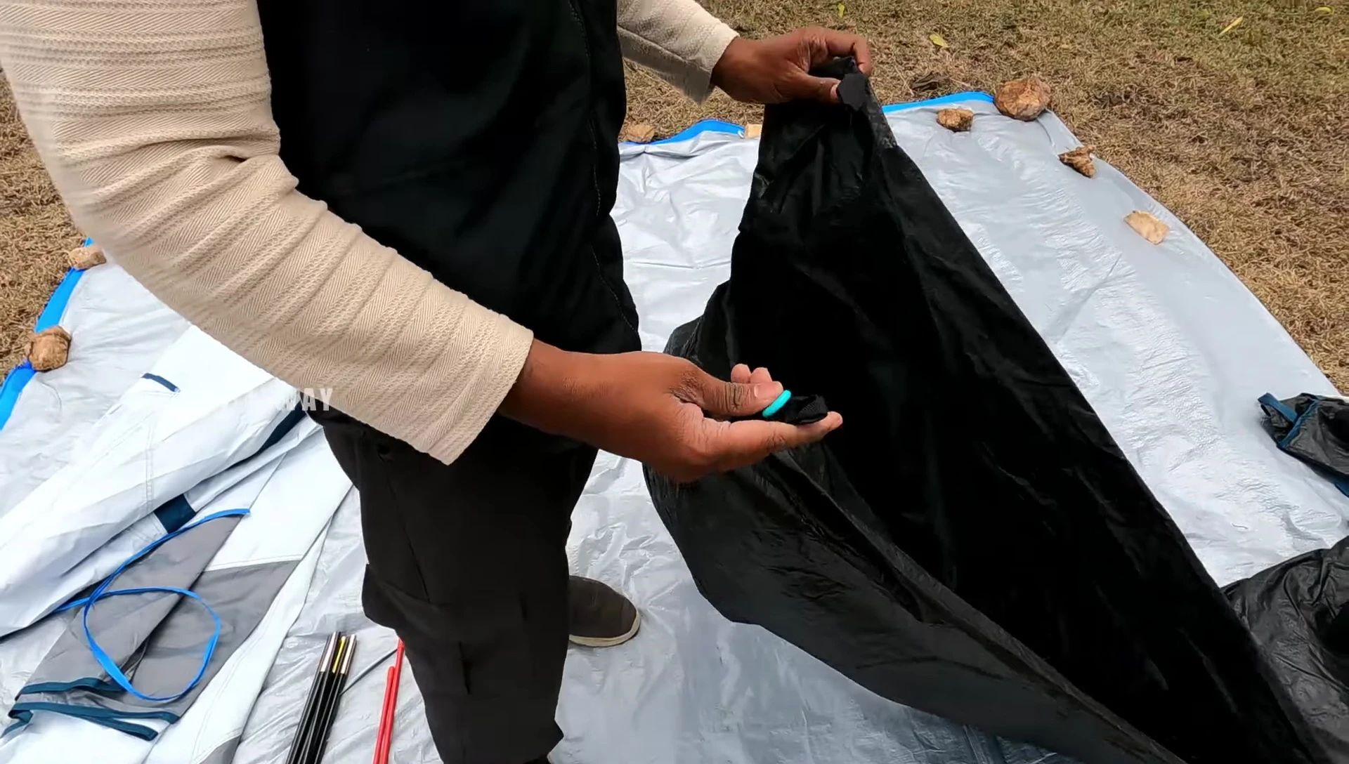 The tent base layer with corner hooks.