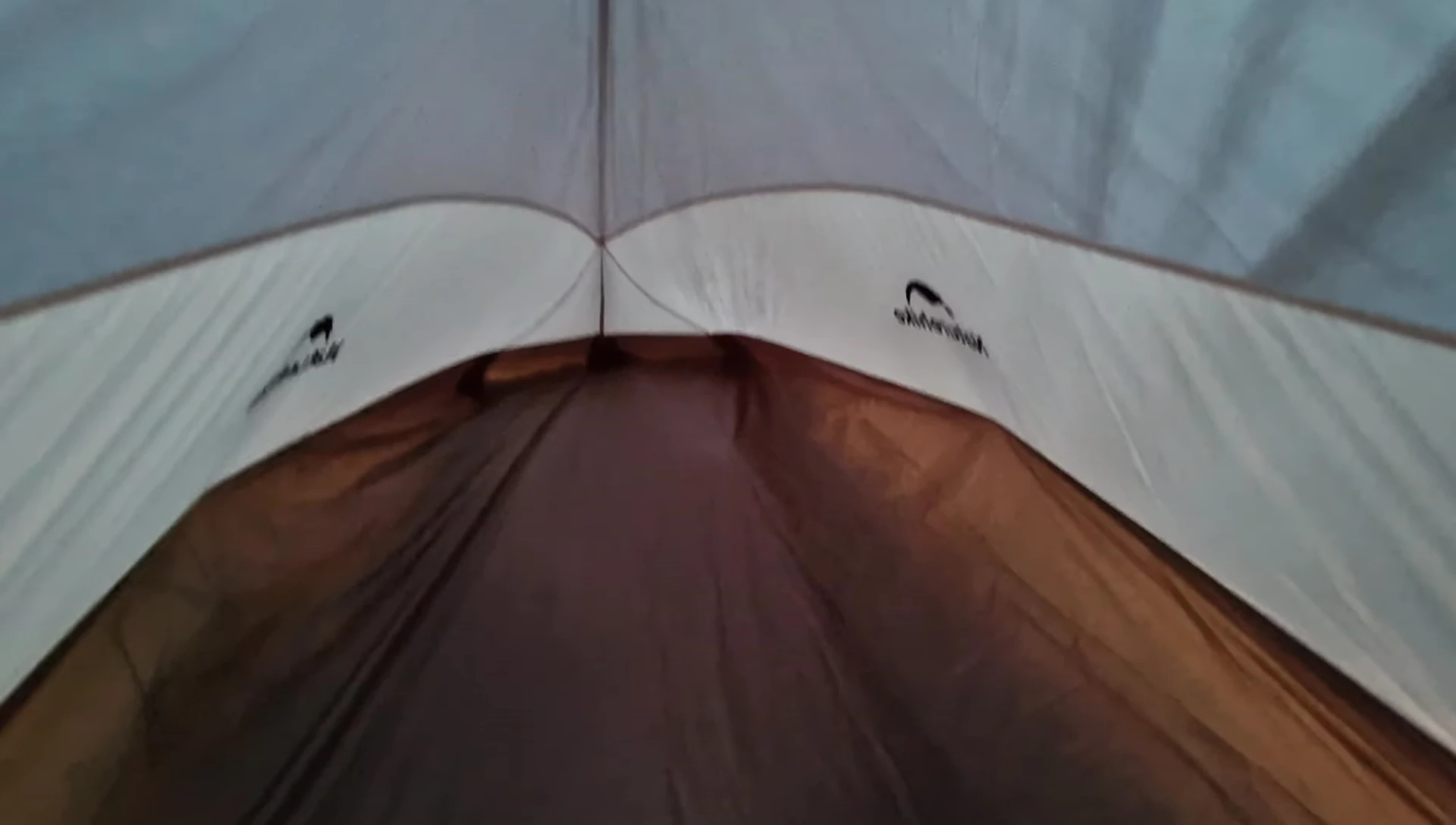 Interior view of the tent after setup, with a lamp added.