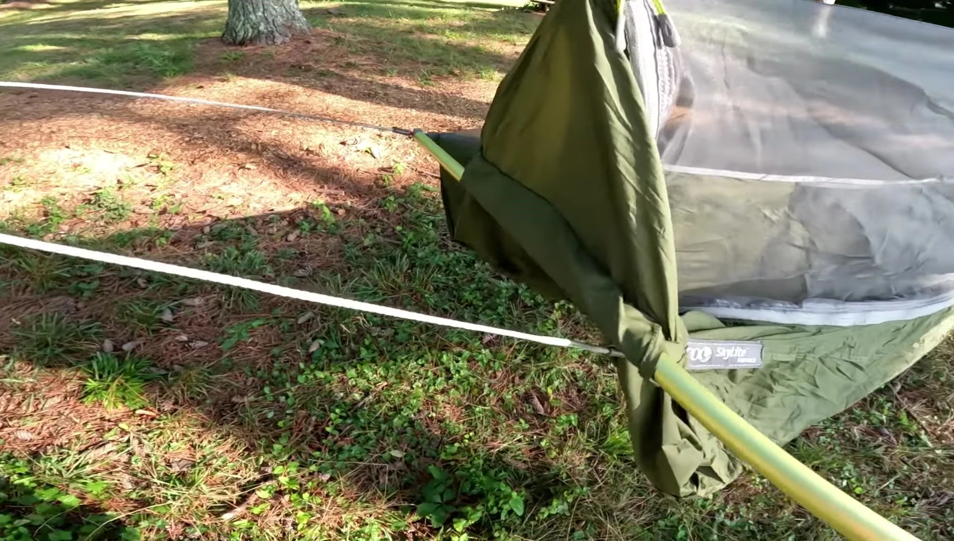 The poles being inserted into the hammock sleeve.