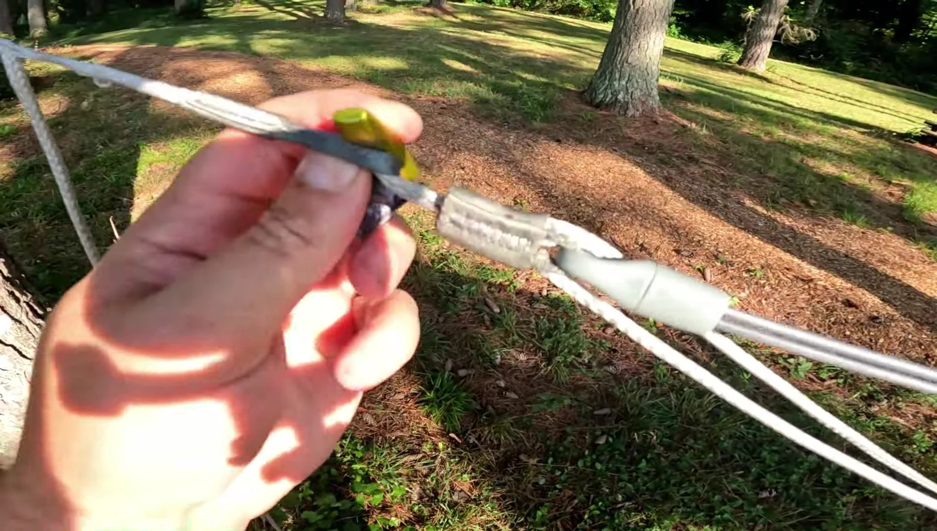 Aluminum toggles being attached to the straps.