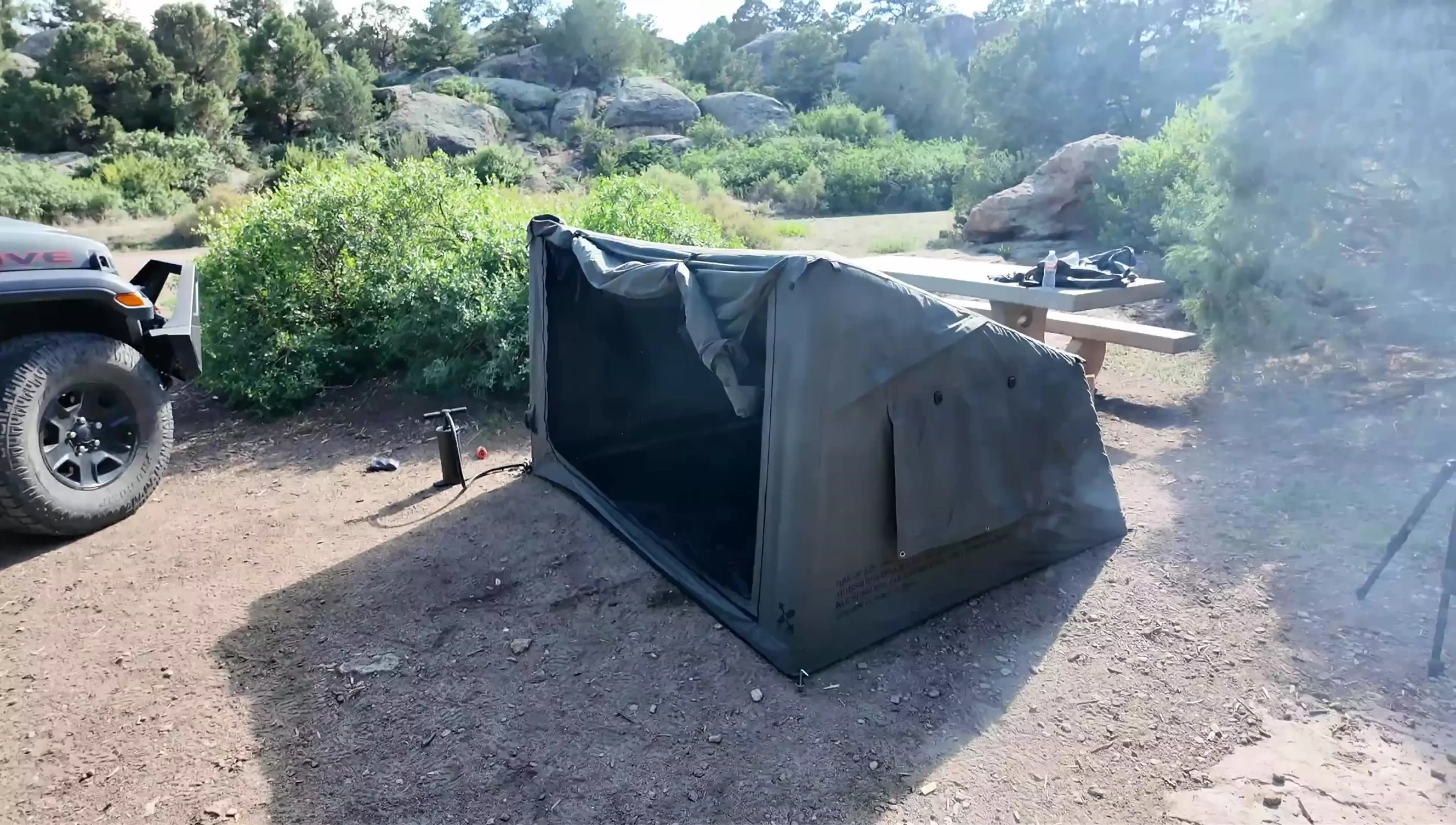 The reviewer demonstrating the overall size of the tent.