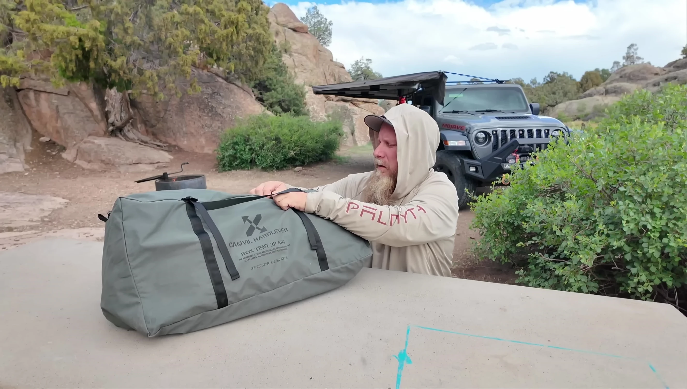 The tent bag being opened to reveal the tent inside.