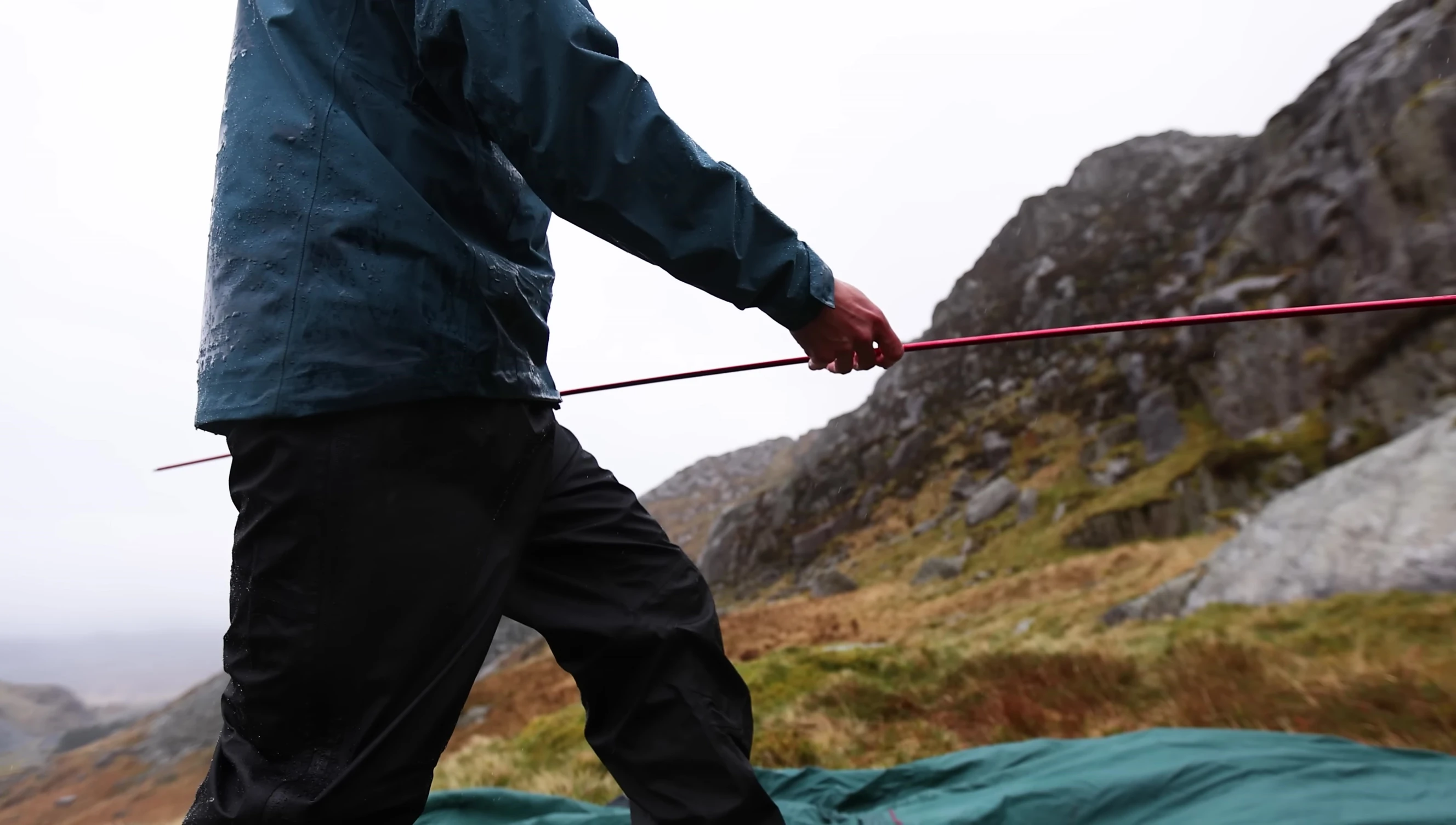 A shot demonstrating the single-hoop aluminum pole and corner poles of the tent.