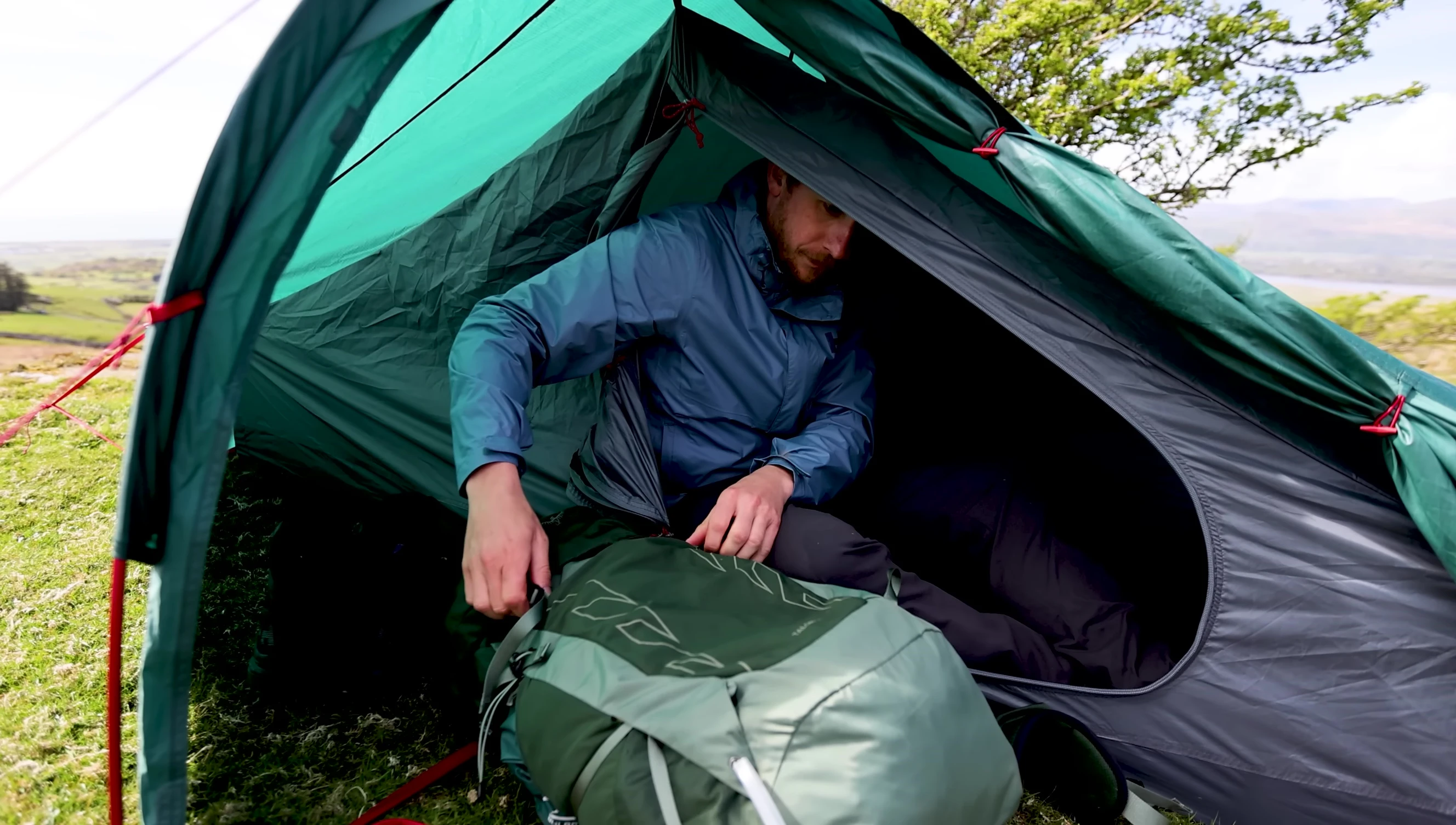 The reviewer lying down inside the tent showing the available space.