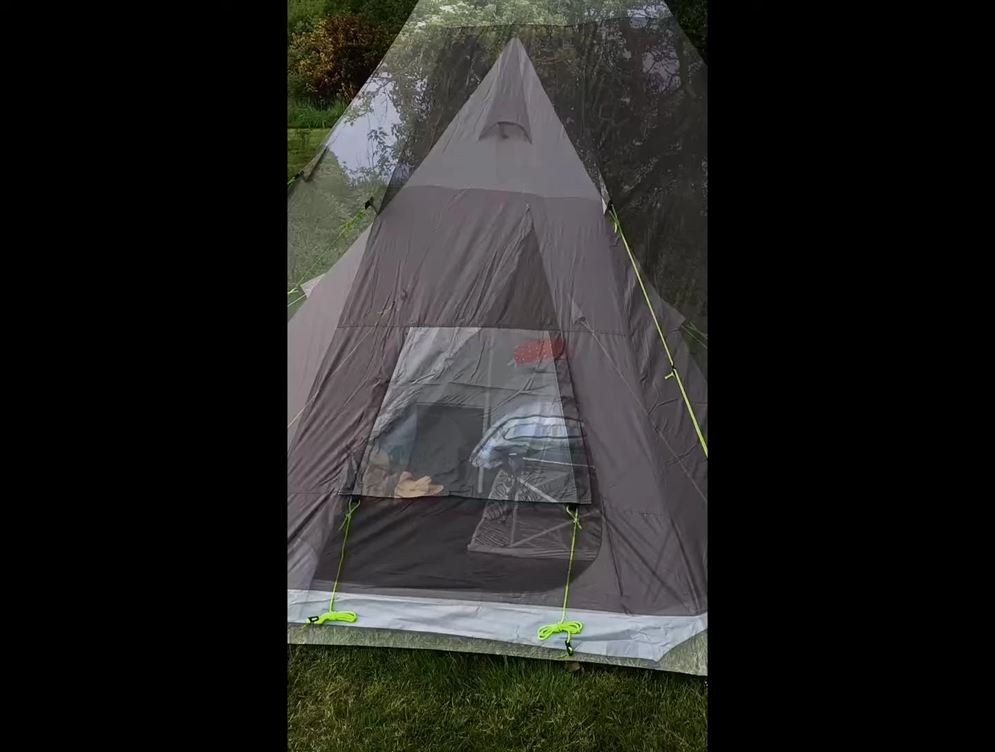 The interior of the tent with camp bed and dogs.