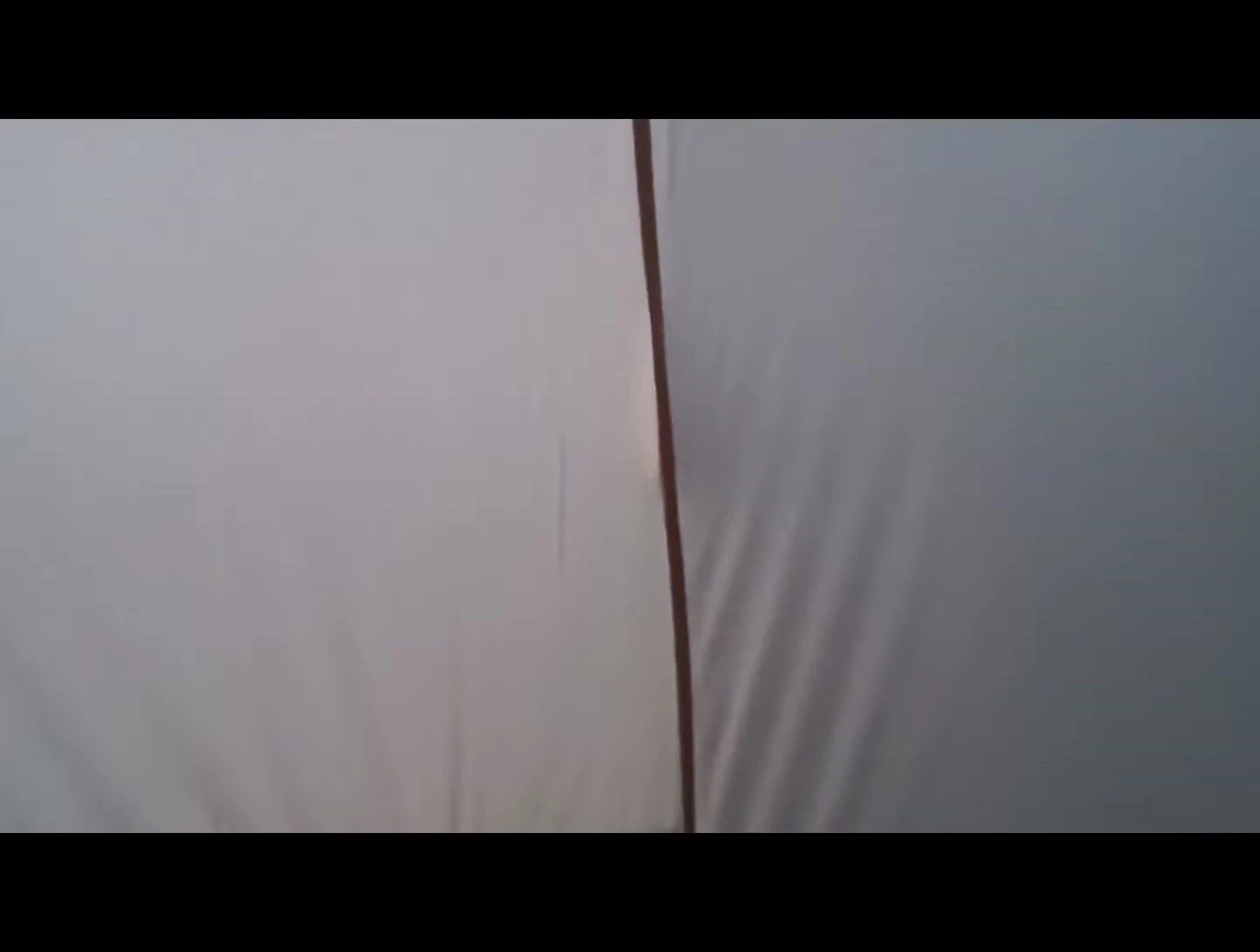 The lantern hanging inside the tent.