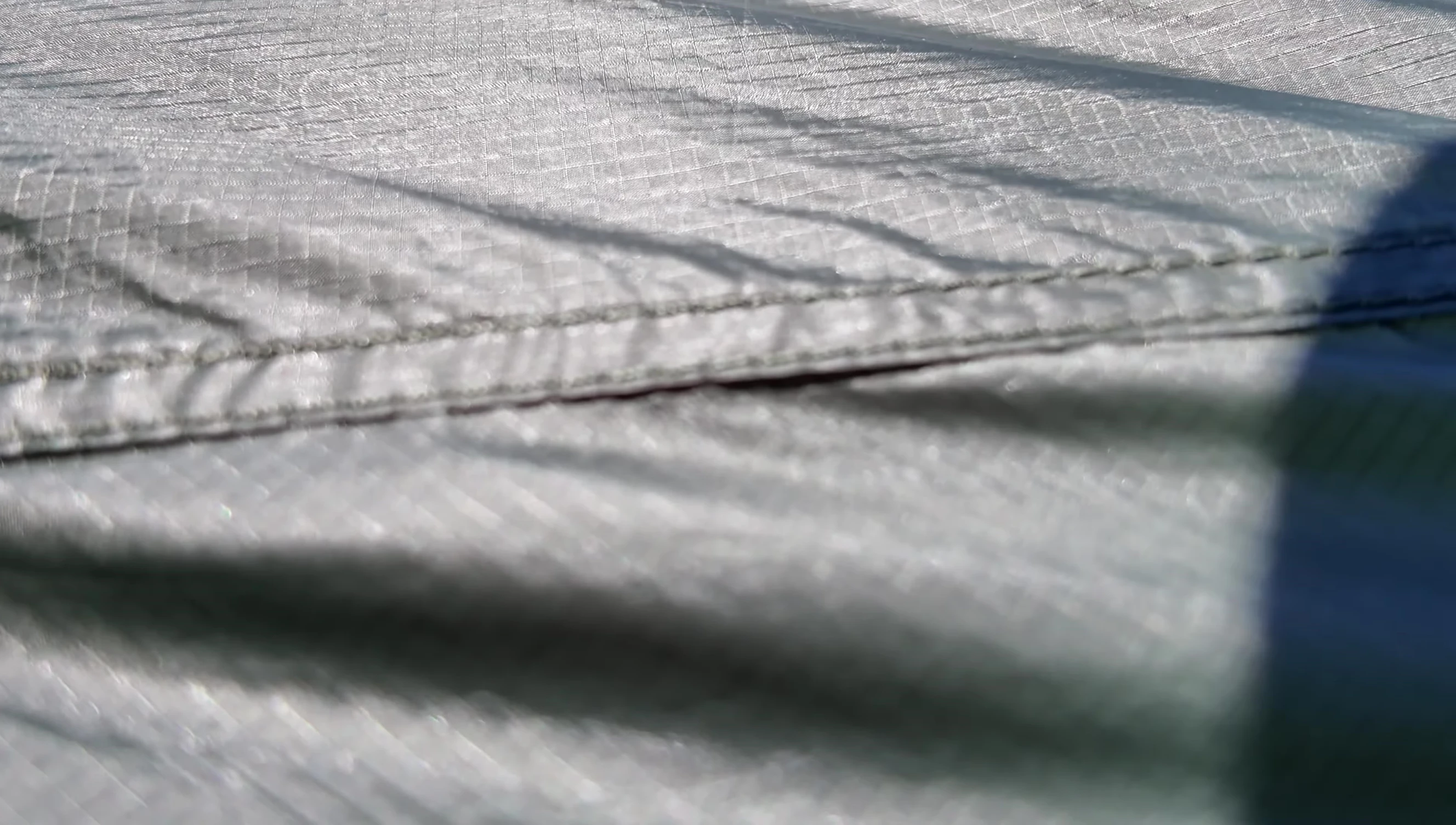 Detailed view of the tent's seams, showcasing the precision stitching and waterproof taping.