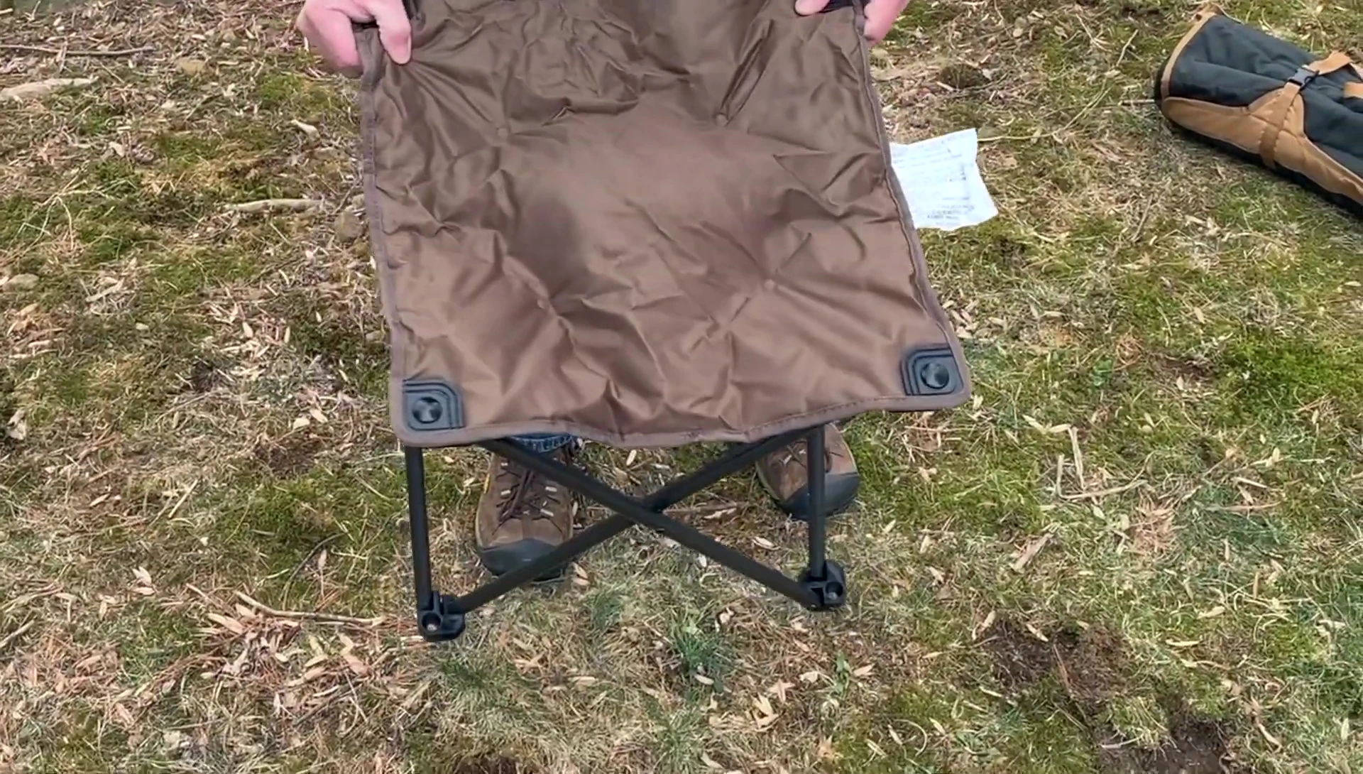 The Guide Gear footstool next to the Kelty chair.