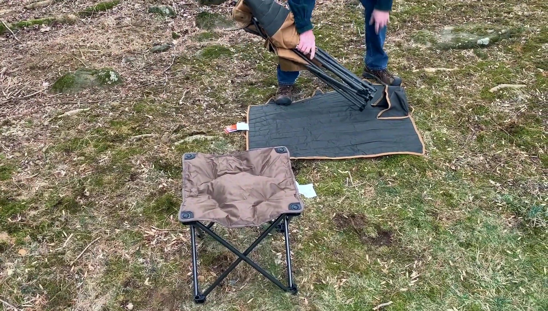 The chair being packed into the carry wrap.