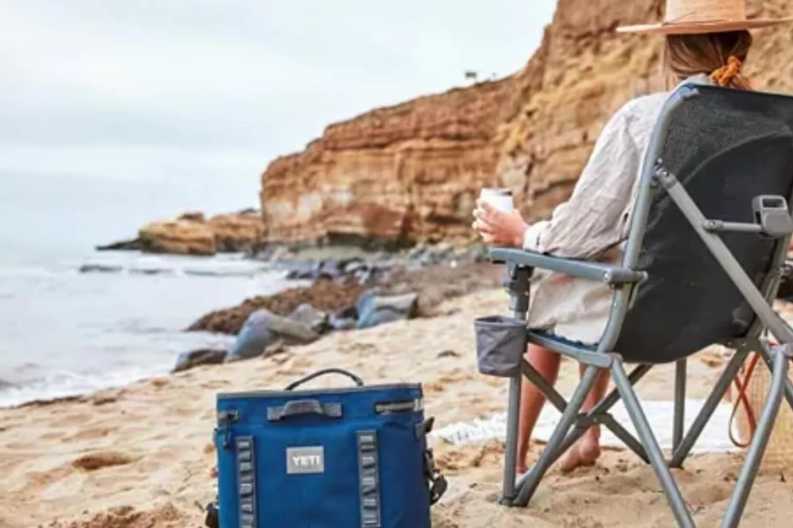 Person demonstrating the chair's folding mechanism
