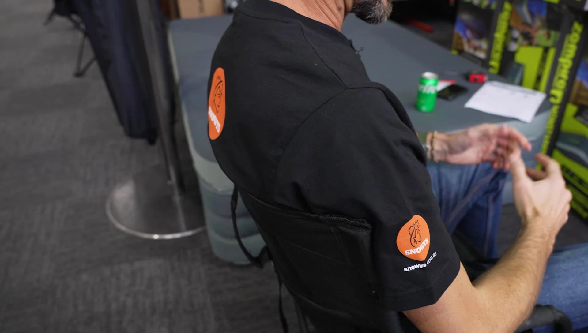 The chair positioned near a table, suggesting its usability at a campsite.