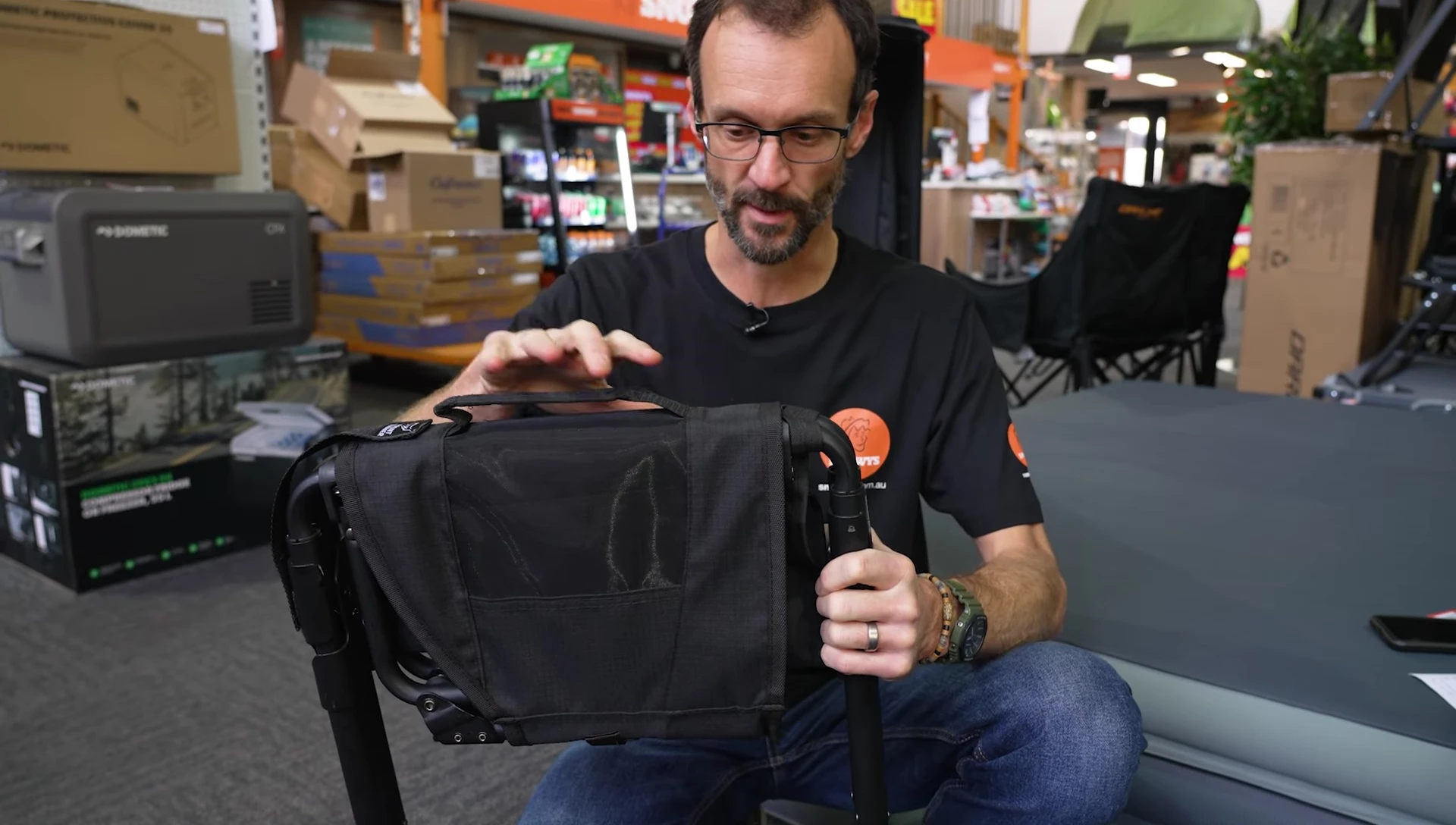 Close-up of the folded Front Runner Expander Camping Chair, showing its compact size and carry handle.