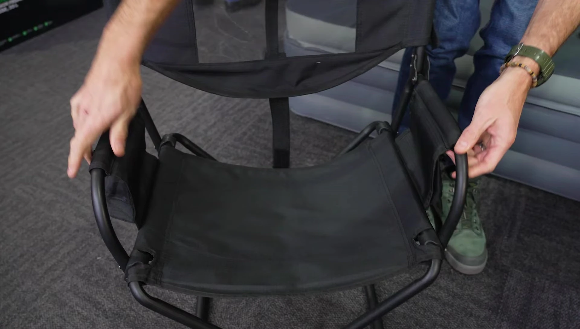 The chair being folded up.